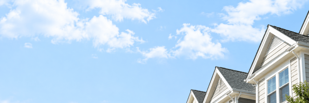 Rows of suburban homes under an open sky, reflecting themes of home, protection, and culturally relevant insurance marketing